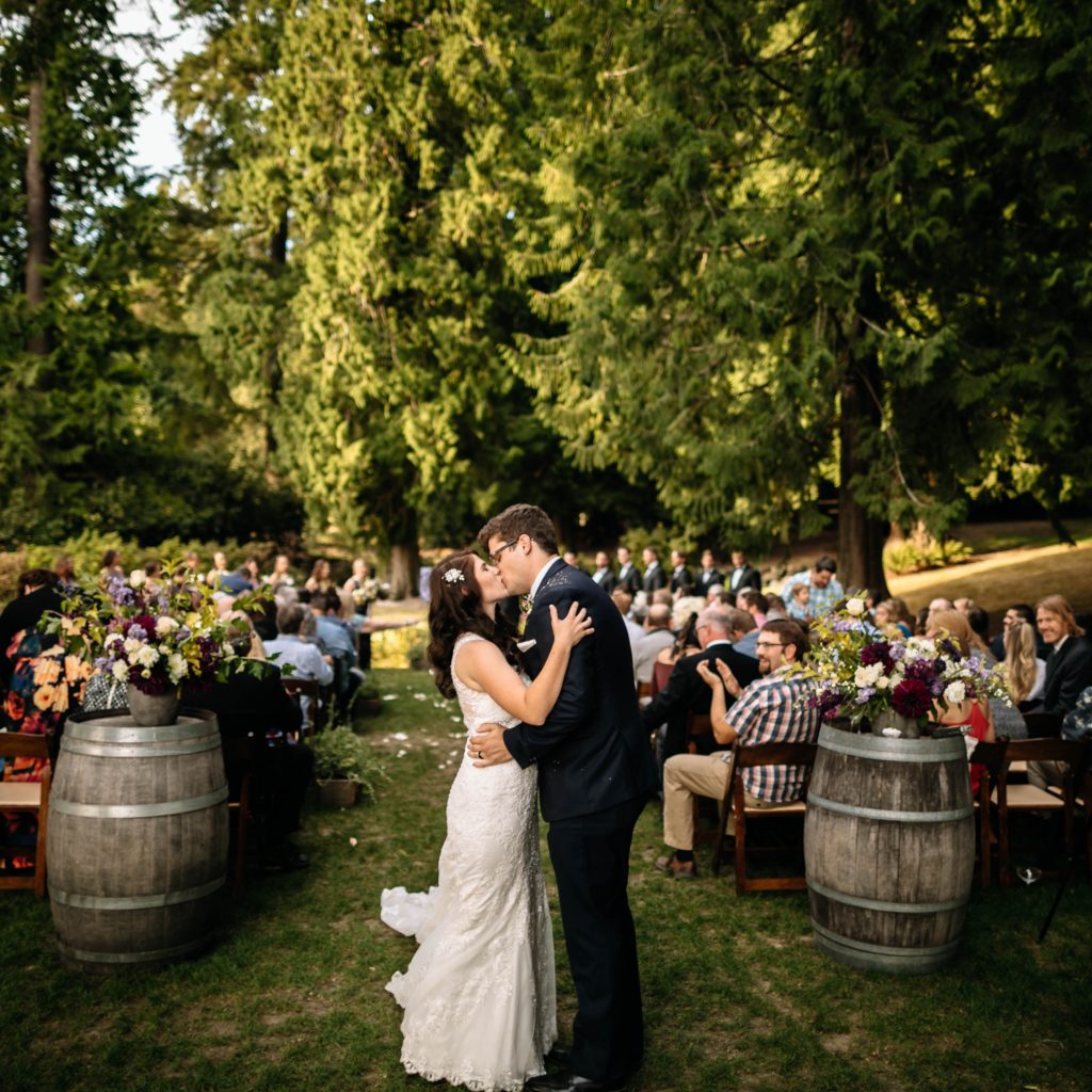 couple kisses delille cellars wedding