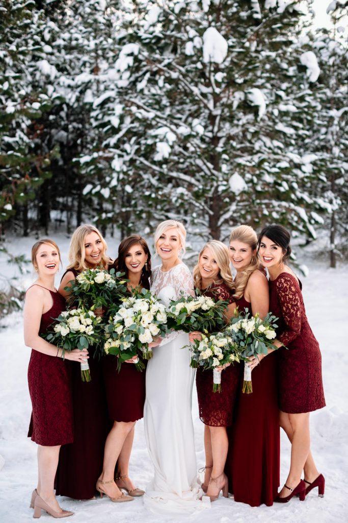 bride and groom walk through the woods sisters oregon wedding