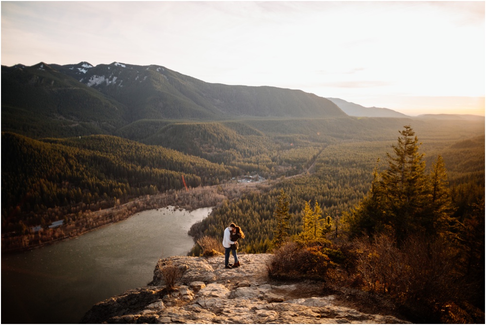Couple kisses Sunset Rattlesnake Ledge Engagement