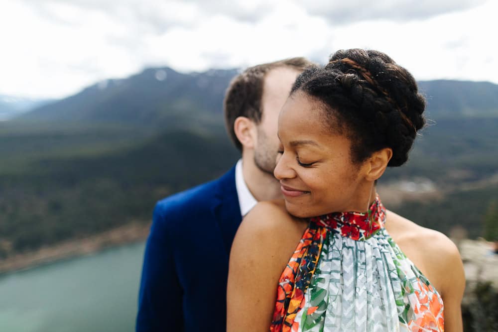Woman smiles with groom during mt rainier elopement photos
