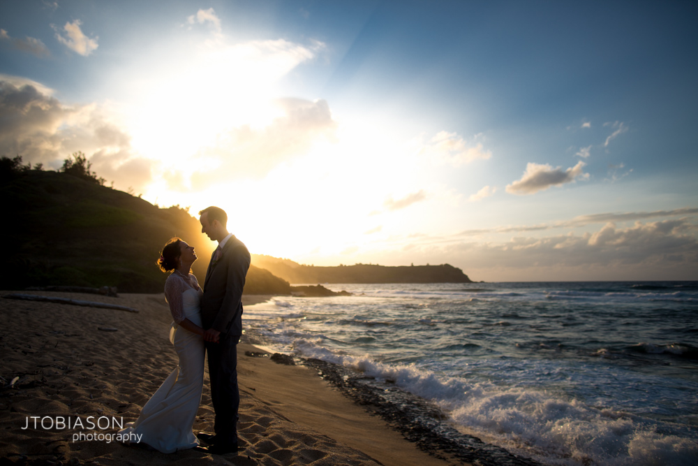 couple kisses kauai Beach wedding Destination photo