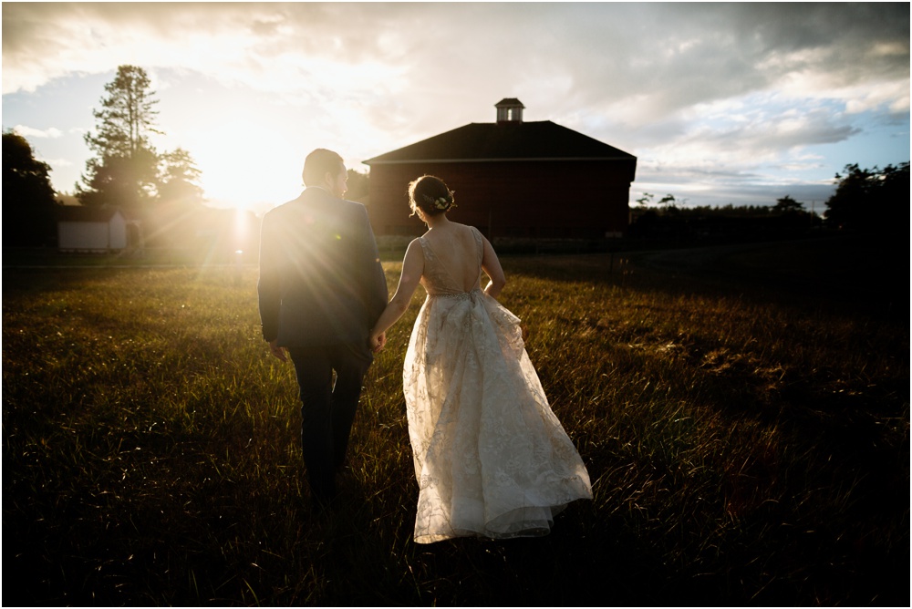 bride and groom walk in the sunset