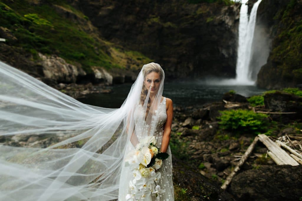 Bride and her veil by snoqualmie falls Salish Lodge wedding
