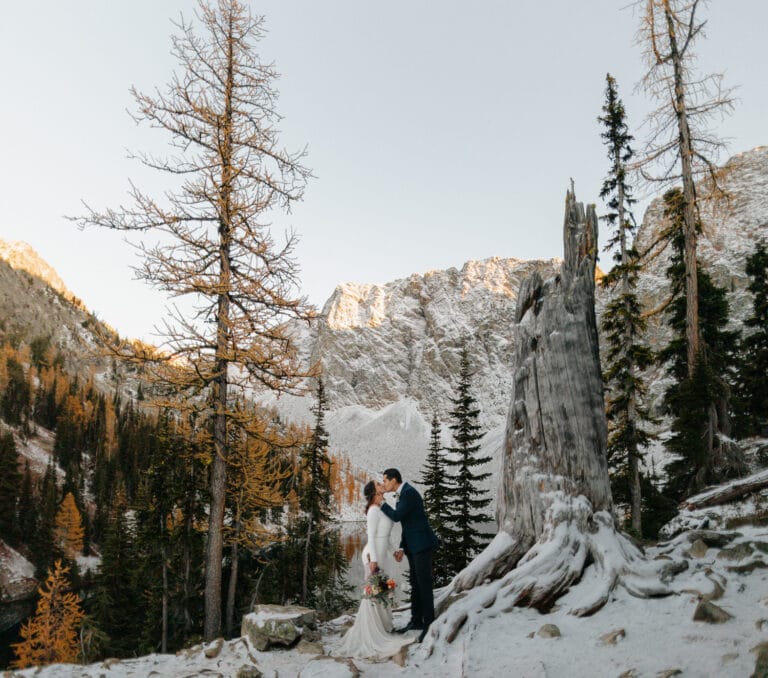 couple kisses during Washington State elopement at Blue Lake in North Cascades National Park