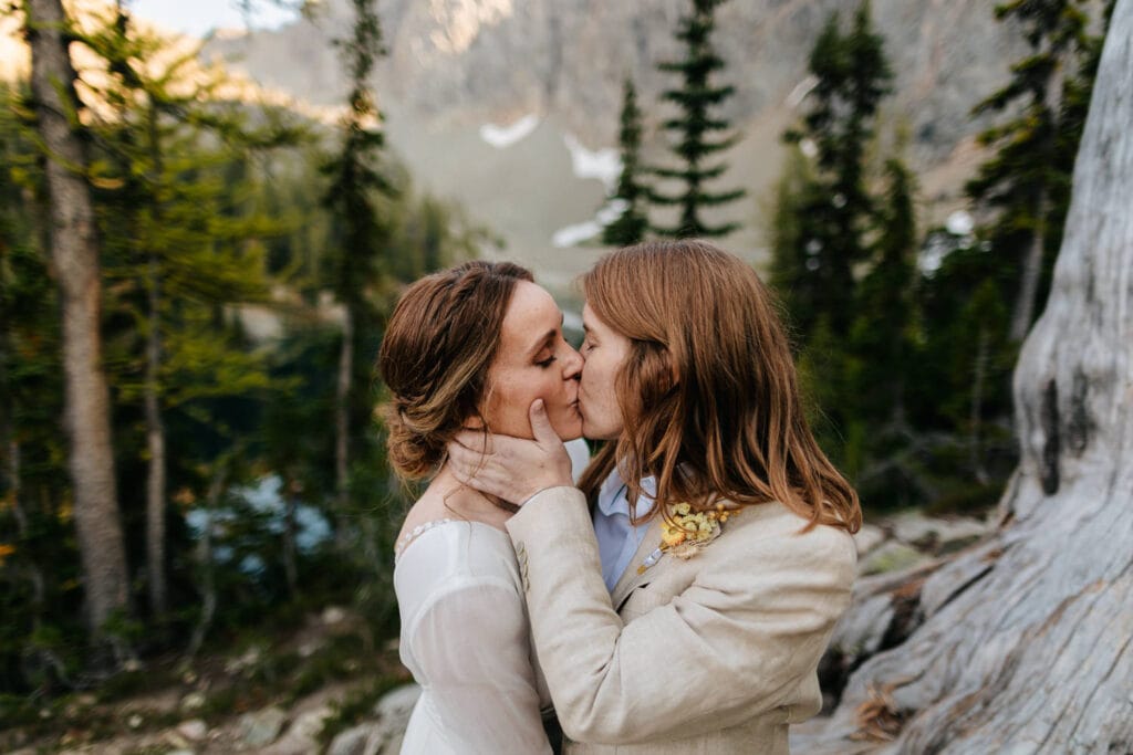 brides kiss at sunset during north cascades lesbian legbtq elopement